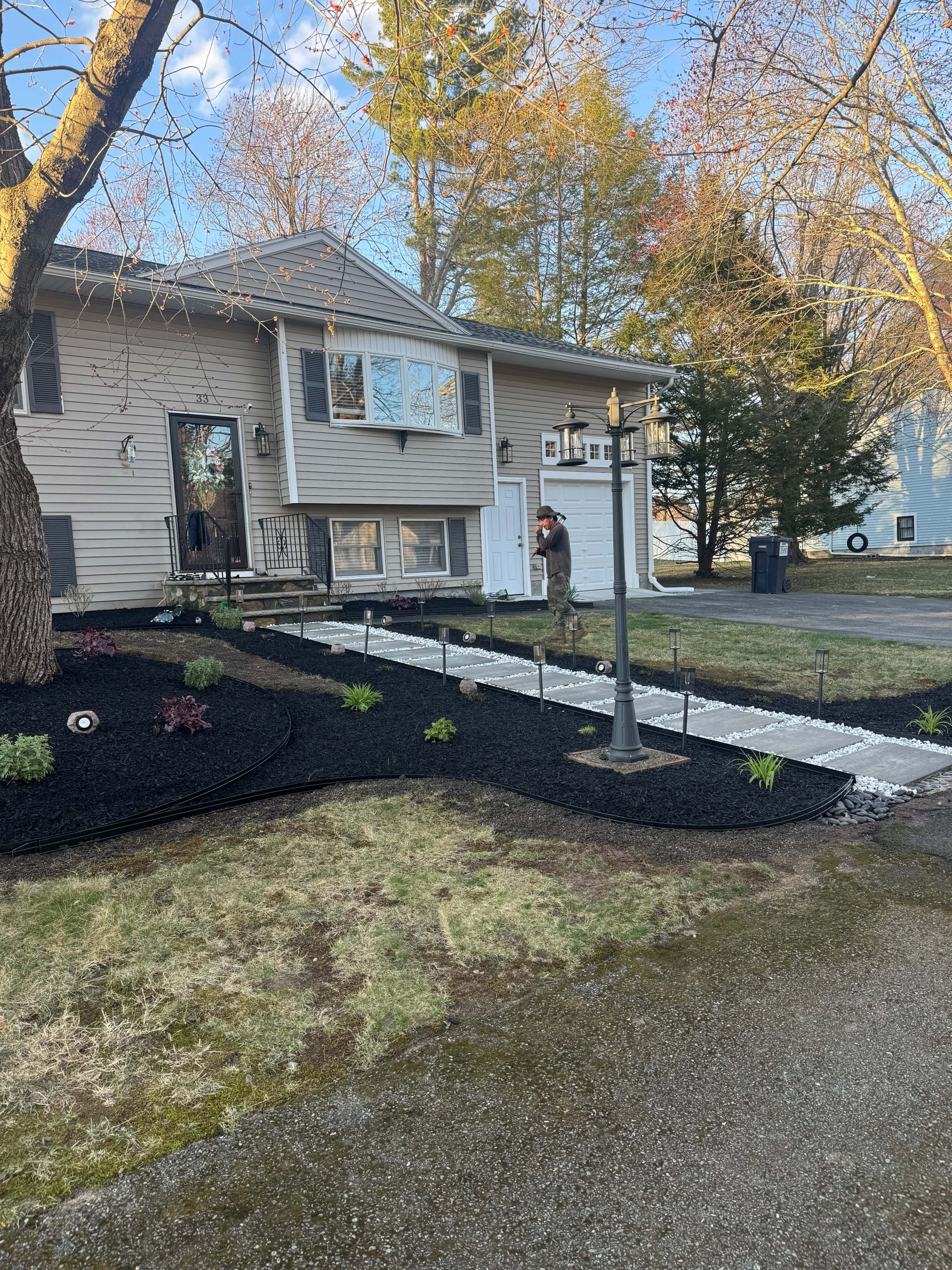 How Professional Landscaping Improves Property Value and Curb Appeal 2 Modern front yard landscaping with pathway lighting and curb appeal improvements