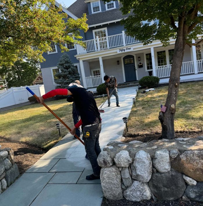 Professional bluestone walkway installation leading to a residential front entrance by Grounds of Nature Landscaping Inc.